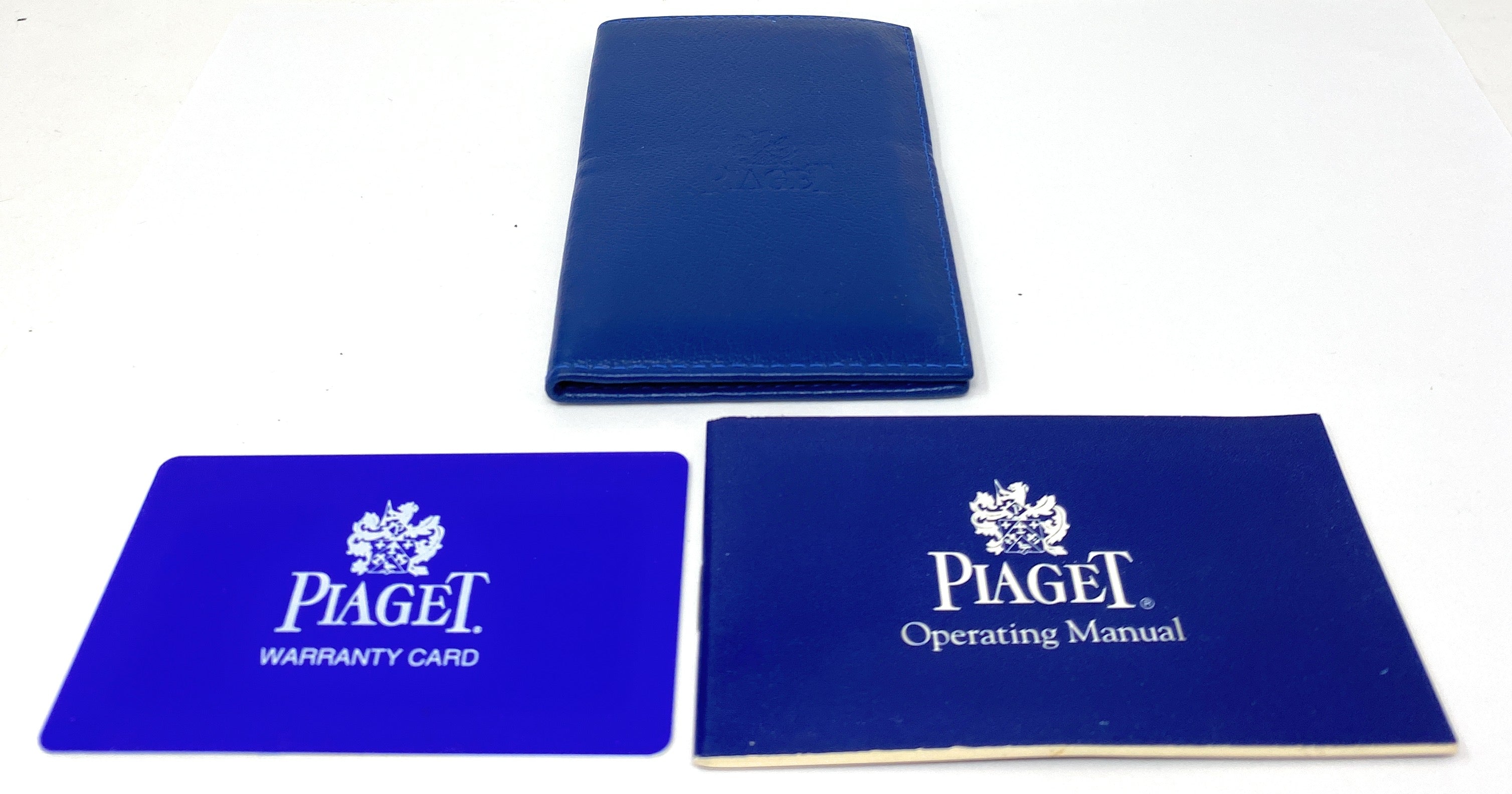 Piaget Operating Manual with 1 Year Warranty Card in a Blue Folder
